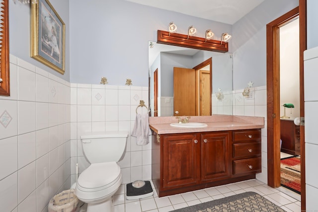 17A Morris Rd, Prospect, CT 06712 - bathroom featuring tile walls, tile patterned floors, vanity, toilet, and a wainscoted wall