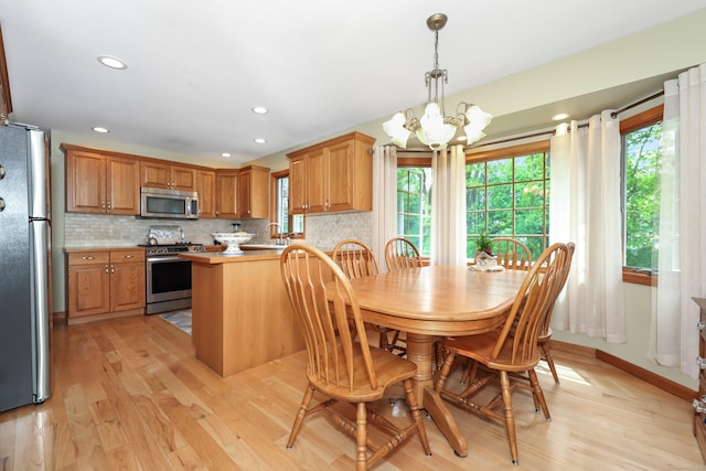17A Morris Rd, Prospect, CT 06712 - dining space featuring a chandelier, light wood finished floors, healthy amount of natural light, and recessed lighting
