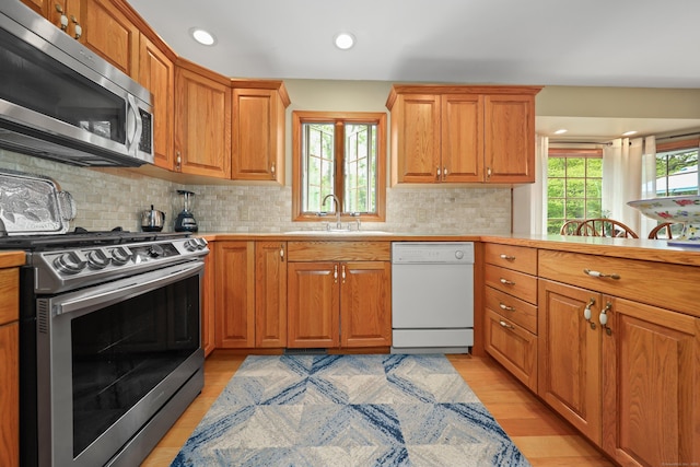17A Morris Rd, Prospect, CT 06712 - kitchen with appliances with stainless steel finishes, a sink, decorative backsplash, light countertops, and recessed lighting