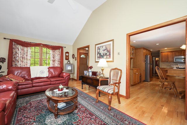 17A Morris Rd, Prospect, CT 06712 - living area featuring light wood finished floors, high vaulted ceiling, and ceiling fan