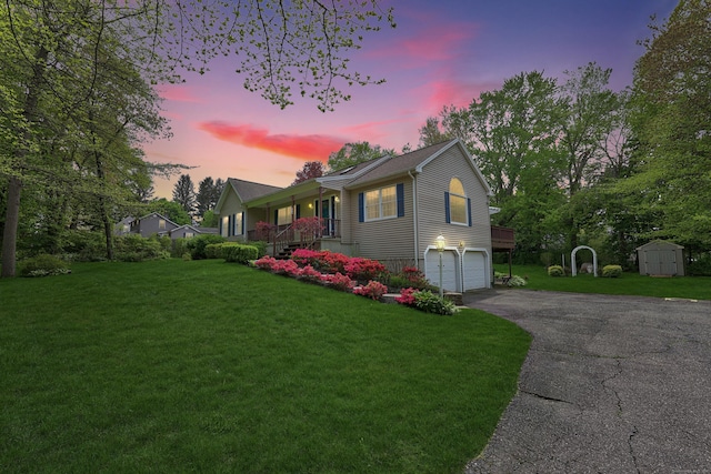 17A Morris Rd, Prospect, CT 06712 - single story home with a storage shed, a porch, an attached garage, a lawn, and asphalt driveway