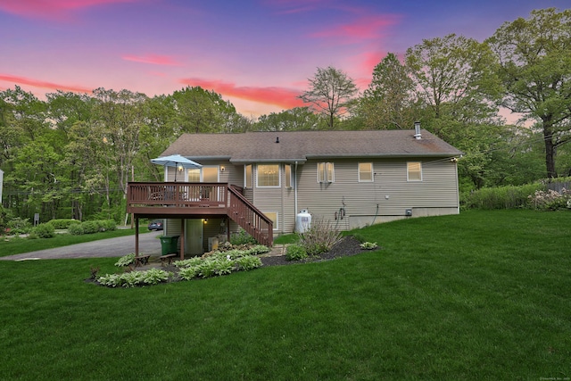 17A Morris Rd, Prospect, CT 06712 - back of house at dusk with a wooden deck, a yard, and stairs