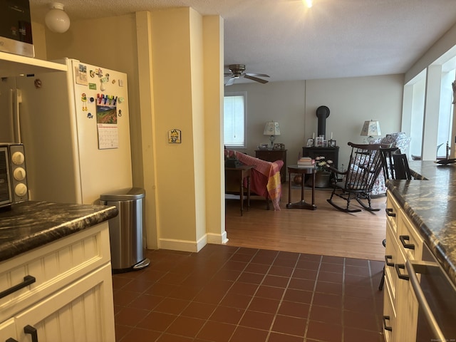 70 Lynn Rd, Essex, CT 06442 - kitchen featuring a ceiling fan, dark countertops, and dark tile patterned flooring