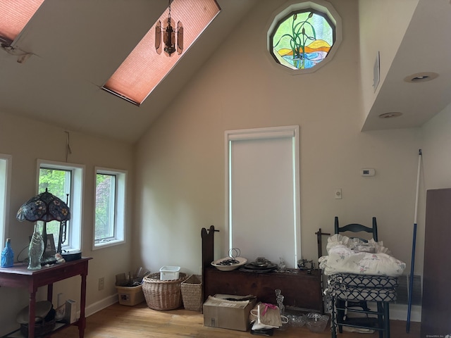 70 Lynn Rd, Essex, CT 06442 - bedroom with high vaulted ceiling, wood finished floors, and baseboards
