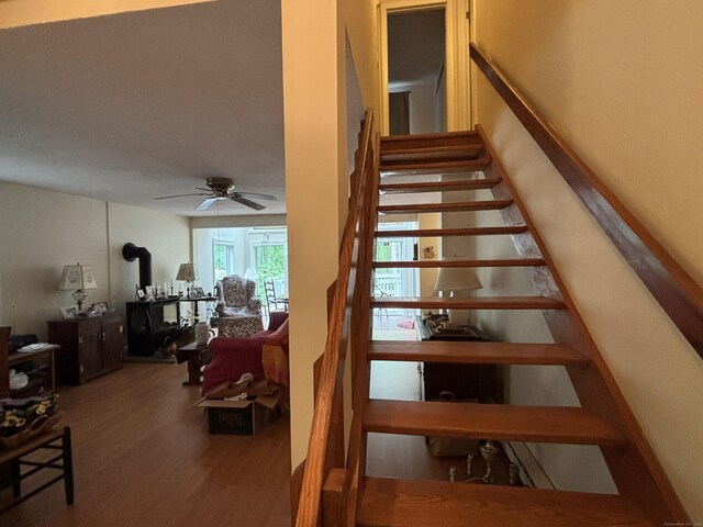 70 Lynn Rd, Essex, CT 06442 - stairs with a wood stove, wood finished floors, and ceiling fan