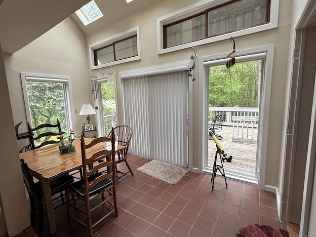 70 Lynn Rd, Essex, CT 06442 - dining space with a skylight, dark tile patterned floors, and plenty of natural light