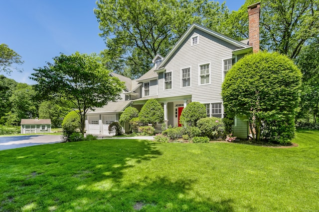 21 Park Pl, Darien, CT 06820 - view of front of property featuring a front lawn, an attached garage, a chimney, and driveway