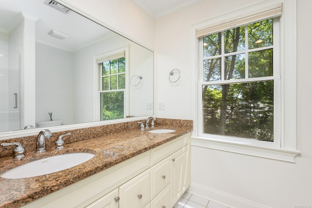 21 Park Pl, Darien, CT 06820 - bathroom with double vanity, a shower with shower door, ornamental molding, and tile patterned floors