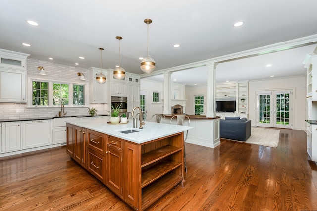 21 Park Pl, Darien, CT 06820 - kitchen featuring a sink, an island with sink, open floor plan, open shelves, and recessed lighting