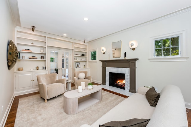 21 Park Pl, Darien, CT 06820 - living area with wood finished floors, a fireplace, ornamental molding, french doors, and baseboards