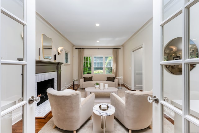 21 Park Pl, Darien, CT 06820 - living area with a brick fireplace, crown molding, wood finished floors, baseboards, and recessed lighting