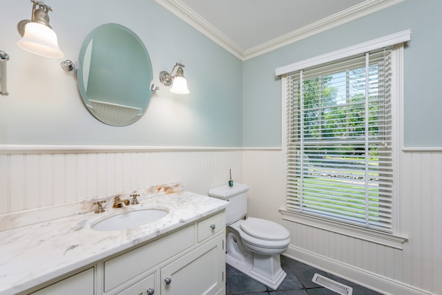 21 Park Pl, Darien, CT 06820 - bathroom featuring toilet, vanity, a wainscoted wall, crown molding, and tile patterned floors