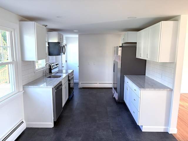 244 Spruce Brook Rd, Berlin, CT 06037 - kitchen featuring a baseboard radiator, a sink, appliances with stainless steel finishes, and light stone countertops