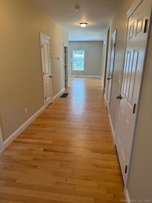 60 Pinehurst Dr Unit 60, East Haven, CT 06513 - corridor featuring light wood finished floors and baseboards