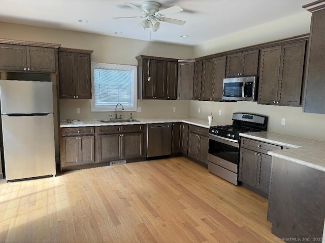 60 Pinehurst Dr Unit 60, East Haven, CT 06513 - kitchen featuring appliances with stainless steel finishes, a sink, dark brown cabinetry, a ceiling fan, and recessed lighting
