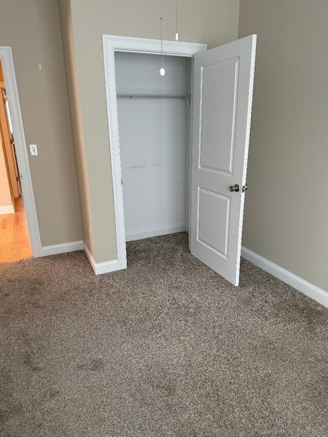 60 Pinehurst Dr Unit 60, East Haven, CT 06513 - unfurnished bedroom featuring carpet, a closet, and baseboards