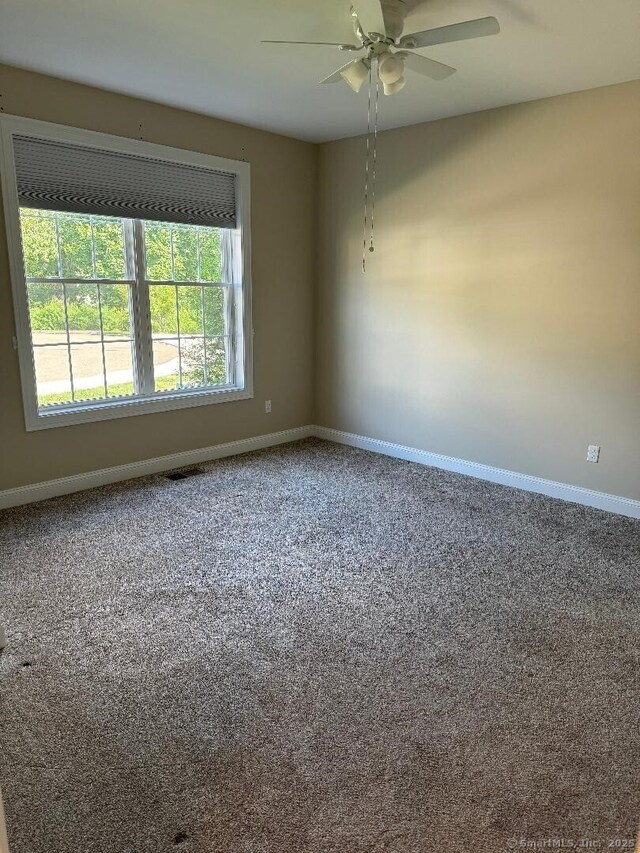 60 Pinehurst Dr Unit 60, East Haven, CT 06513 - unfurnished room with baseboards, carpet, and ceiling fan
