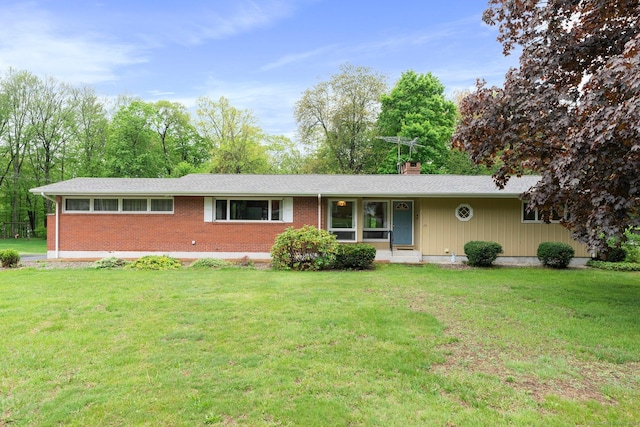 16 Ellsworth Rd, East Windsor, CT 06016 - single story home with brick siding, a front lawn, and a chimney