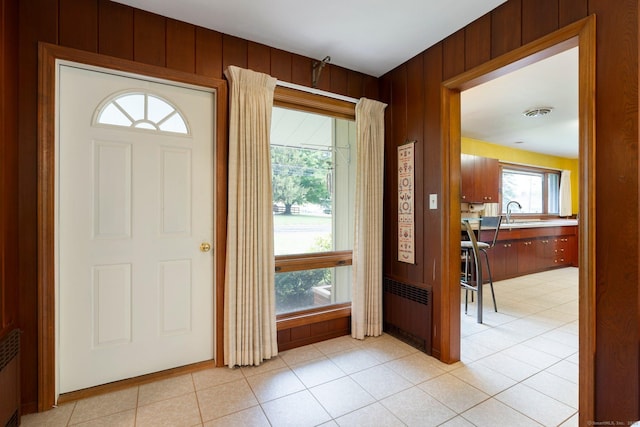 16 Ellsworth Rd, East Windsor, CT 06016 - entryway with wooden walls and light tile patterned flooring