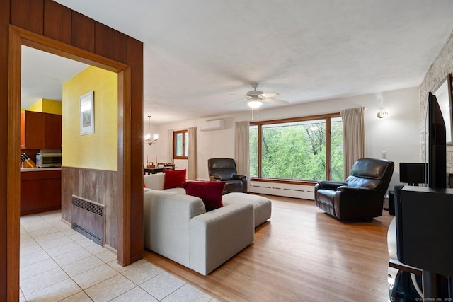 16 Ellsworth Rd, East Windsor, CT 06016 - living room featuring a wall mounted AC, a baseboard radiator, a ceiling fan, a chandelier, and radiator