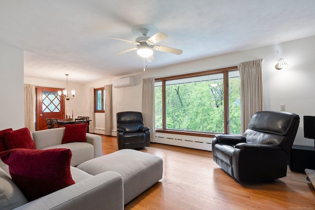 16 Ellsworth Rd, East Windsor, CT 06016 - living area with baseboard heating, a chandelier, light wood finished floors, and a wall mounted AC