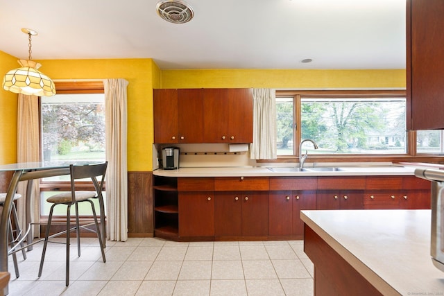 16 Ellsworth Rd, East Windsor, CT 06016 - kitchen featuring a sink, light countertops, pendant lighting, and plenty of natural light