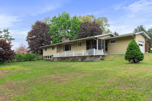 16 Ellsworth Rd, East Windsor, CT 06016 - view of front of home with an attached garage, a front lawn, a sunroom, and a chimney
