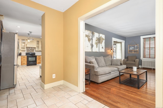 30 Birchwood St, Waterbury, CT 06708 - living room with radiator, baseboards, and recessed lighting
