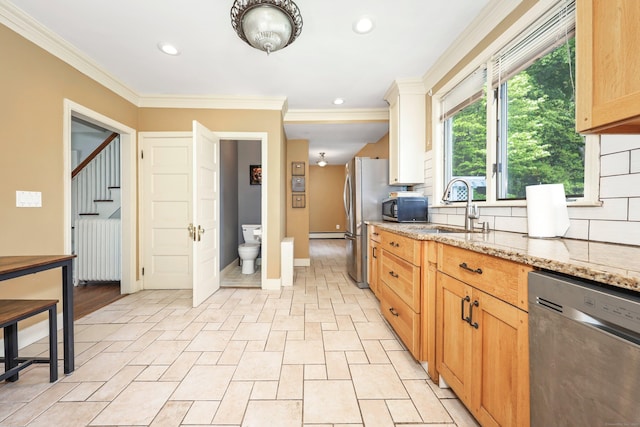 30 Birchwood St, Waterbury, CT 06708 - kitchen with stainless steel appliances, a sink, tasteful backsplash, radiator heating unit, and crown molding