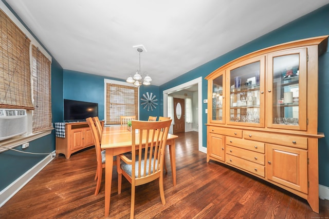 30 Birchwood St, Waterbury, CT 06708 - dining area featuring a chandelier, dark wood-style flooring, baseboards, and cooling unit
