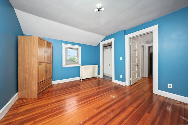 30 Birchwood St, Waterbury, CT 06708 - unfurnished bedroom featuring radiator, lofted ceiling, baseboards, wood finished floors, and a closet