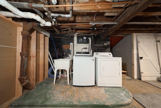 30 Birchwood St, Waterbury, CT 06708 - unfinished below grade area featuring washer and dryer