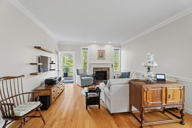 20 Webster Ln Unit 20, Middletown, CT 06457 - living room featuring light wood finished floors, a brick fireplace, crown molding, and recessed lighting