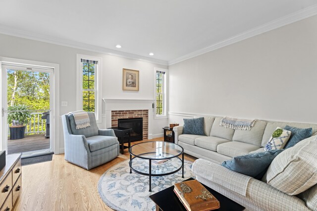 20 Webster Ln Unit 20, Middletown, CT 06457 - living room with light wood finished floors, plenty of natural light, crown molding, a fireplace, and recessed lighting