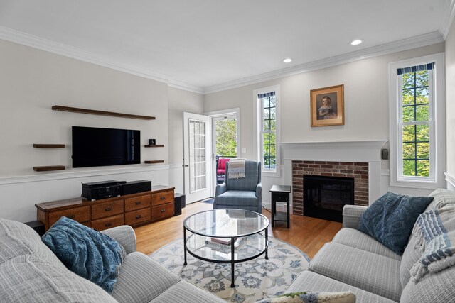 20 Webster Ln Unit 20, Middletown, CT 06457 - living area with healthy amount of natural light, wood finished floors, ornamental molding, recessed lighting, and a fireplace