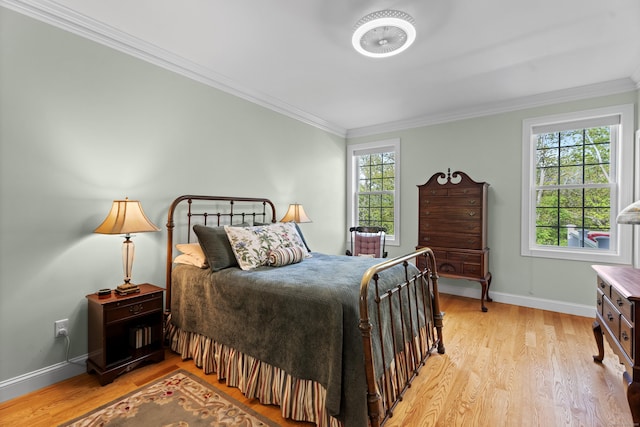 20 Webster Ln Unit 20, Middletown, CT 06457 - bedroom with baseboards, light wood-style flooring, and crown molding
