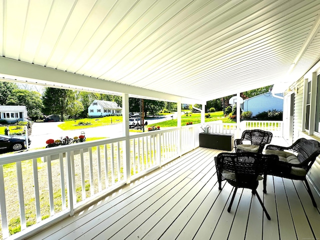 17 Aspen Ct, Norwich, CT 06360 - wooden deck with covered porch and a yard