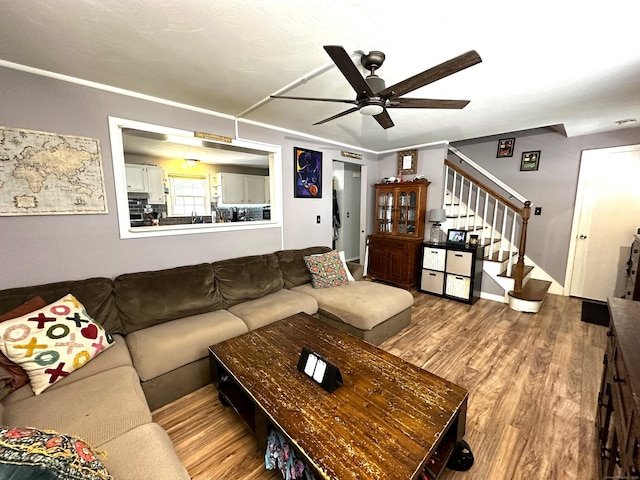 17 Aspen Ct, Norwich, CT 06360 - living area featuring ceiling fan, wood finished floors, and stairs