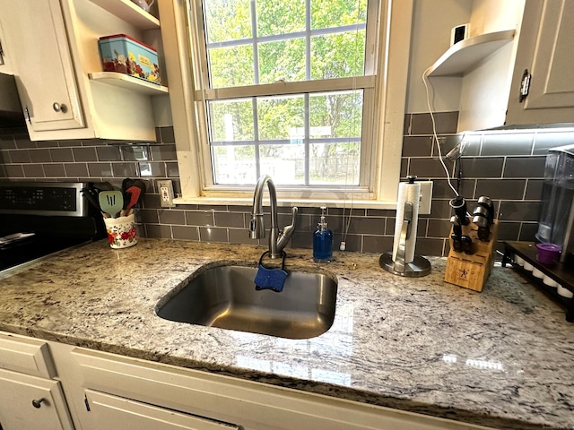 17 Aspen Ct, Norwich, CT 06360 - kitchen with open shelves, a sink, stainless steel range with electric stovetop, and tasteful backsplash