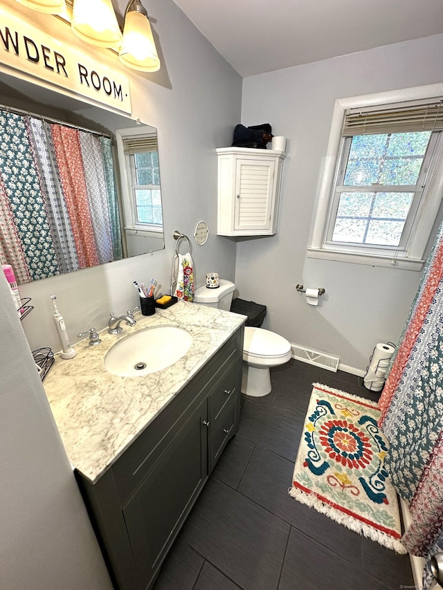 17 Aspen Ct, Norwich, CT 06360 - full bathroom featuring vanity, toilet, and baseboards