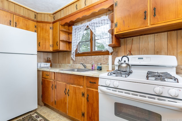 650 Broadview Ter, Hartford, CT 06106 - kitchen featuring white appliances, open shelves, light countertops, and brown cabinetry