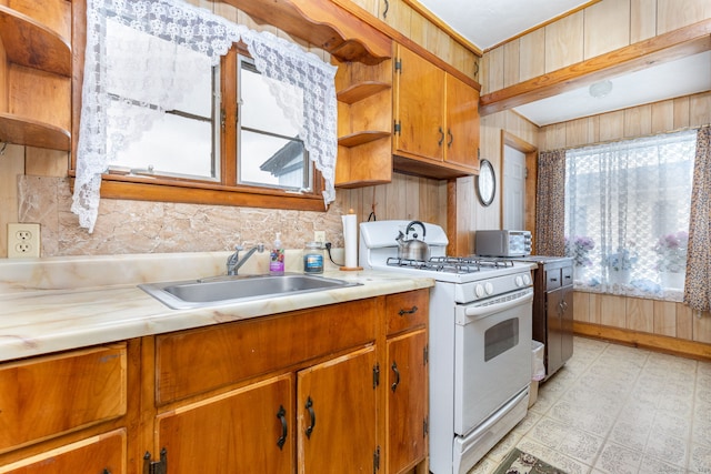 650 Broadview Ter, Hartford, CT 06106 - kitchen with white gas stove, open shelves, a sink, light floors, and light countertops