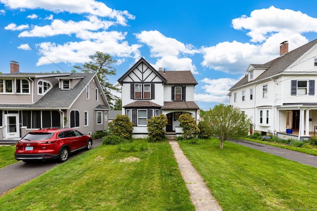 650 Broadview Ter, Hartford, CT 06106 - view of front of property with asphalt driveway, a front lawn, and a porch
