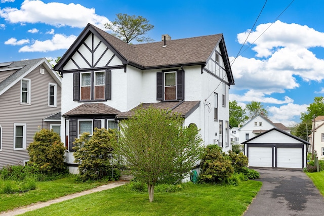 650 Broadview Ter, Hartford, CT 06106 - tudor-style house featuring stucco siding, an outdoor structure, a detached garage, and roof with shingles