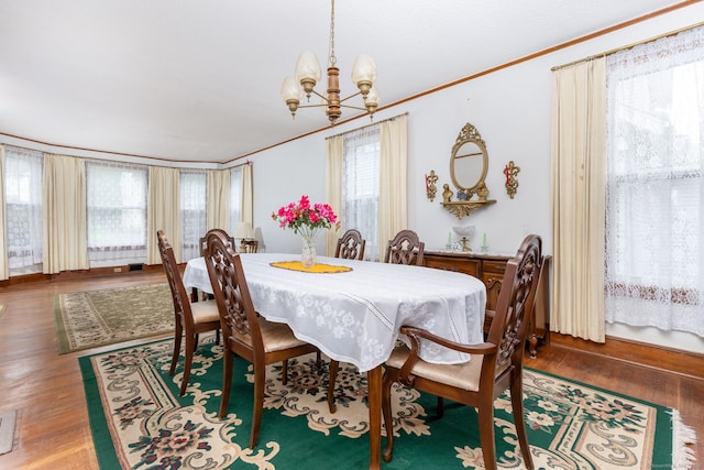 650 Broadview Ter, Hartford, CT 06106 - dining space featuring crown molding, a chandelier, and wood finished floors