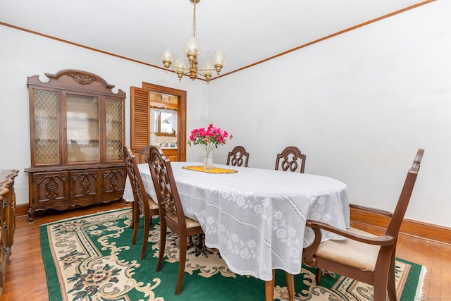 650 Broadview Ter, Hartford, CT 06106 - dining area with a chandelier, crown molding, and wood finished floors
