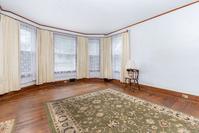650 Broadview Ter, Hartford, CT 06106 - empty room with crown molding, wood-type flooring, baseboards, and healthy amount of natural light