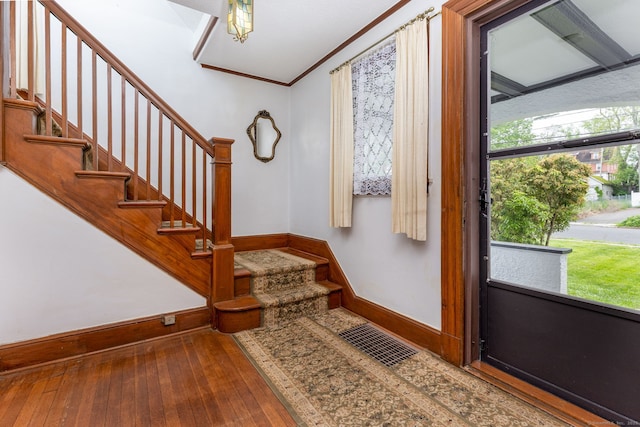650 Broadview Ter, Hartford, CT 06106 - entryway with baseboards, wood-type flooring, stairway, and ornamental molding