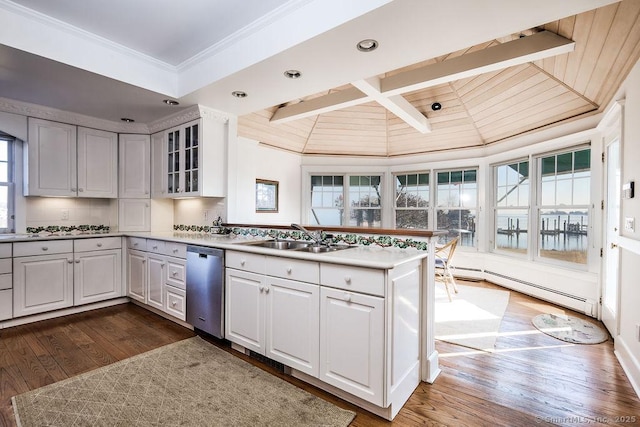 14 Great Marsh Rd, Westport, CT 06880 - kitchen with stainless steel dishwasher, a sink, a peninsula, a baseboard heating unit, and crown molding