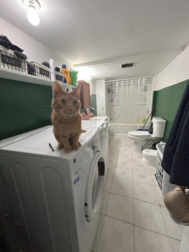 clothes washing area featuring independent washer and dryer